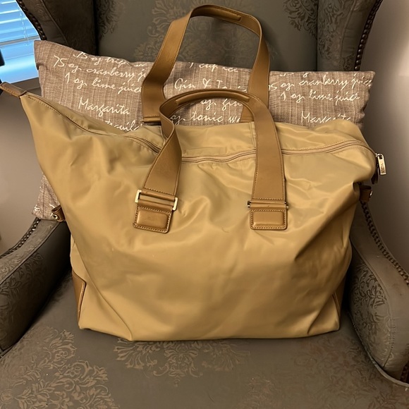 Tumi Handbags - Tumi gold duffel bag